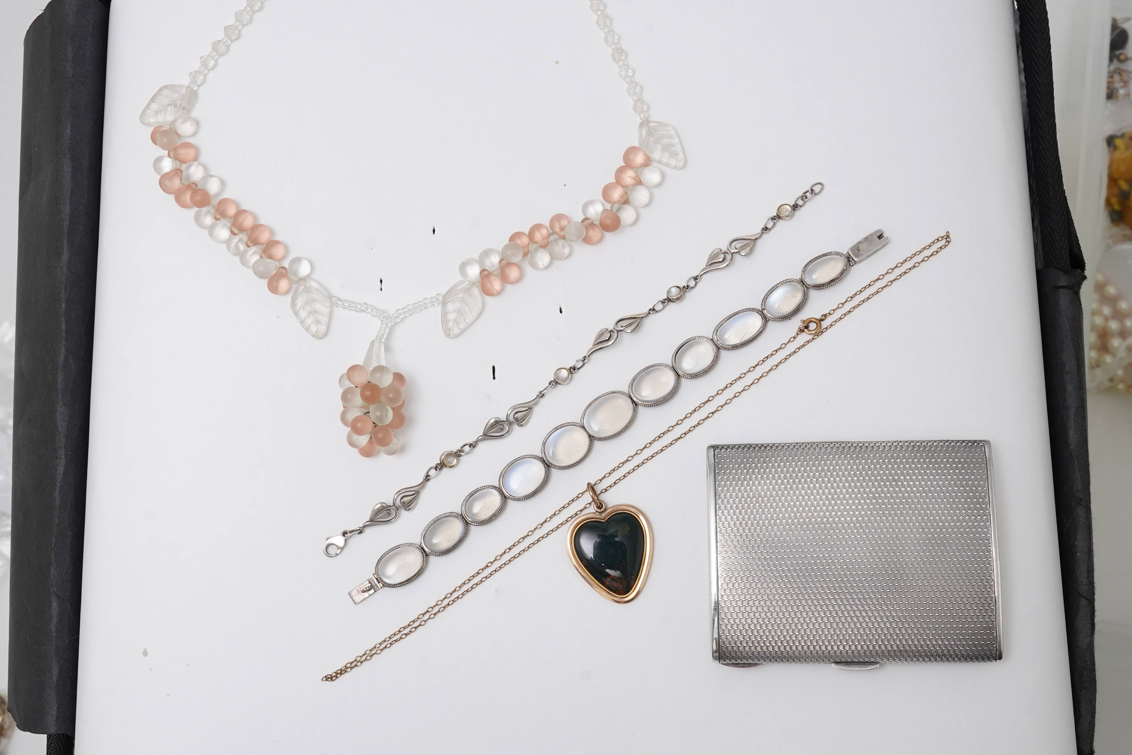 A collection of jewels and accessories including a moonstone bracelet